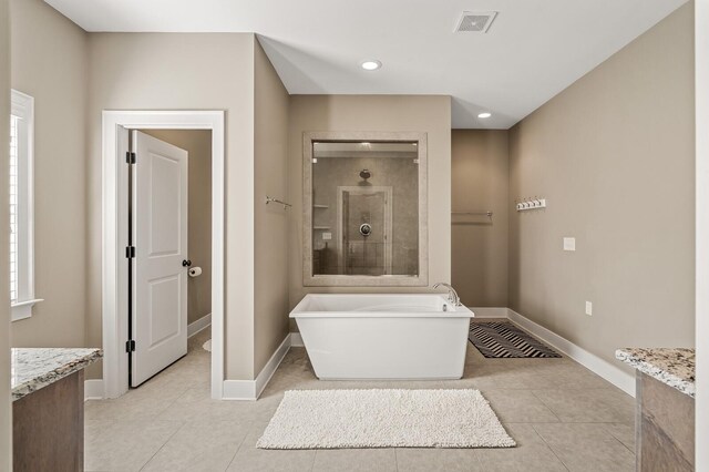 318 Finnhorse Ln, Franklin, TN 37064 - full bath featuring a freestanding tub, tile patterned flooring, vanity, recessed lighting, and a tile shower