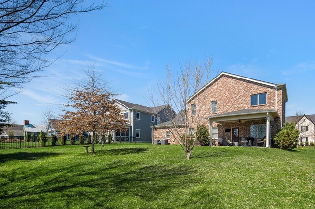 318 Finnhorse Ln, Franklin, TN 37064 - back of house with brick siding and ceiling fan