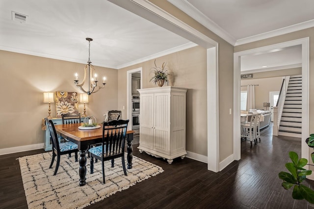 318 Finnhorse Ln, Franklin, TN 37064 - dining space with stairs, a chandelier, dark wood-style floors, and crown molding