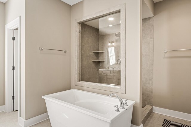 318 Finnhorse Ln, Franklin, TN 37064 - full bathroom featuring a freestanding bath, a tile shower, and tile patterned flooring