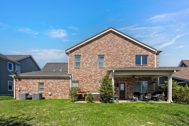 318 Finnhorse Ln, Franklin, TN 37064 - back of house with brick siding, a patio, ceiling fan, and a yard