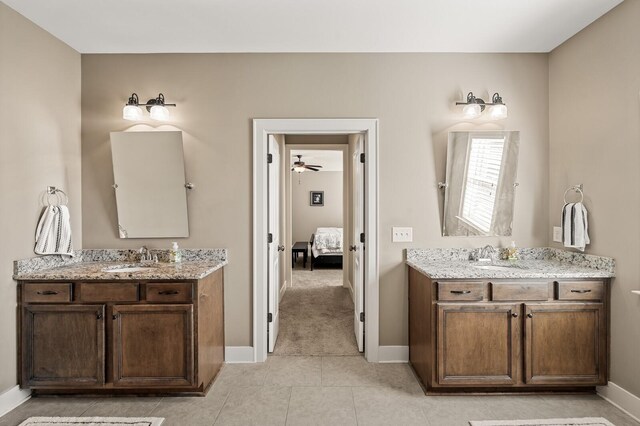 318 Finnhorse Ln, Franklin, TN 37064 - bathroom with connected bathroom, two vanities, tile patterned floors, and a ceiling fan