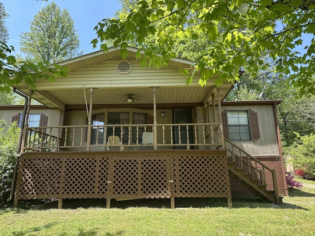 4719 Bogard Rd, Cosby, TN 37722 - back of house featuring covered porch, stairway, and a yard