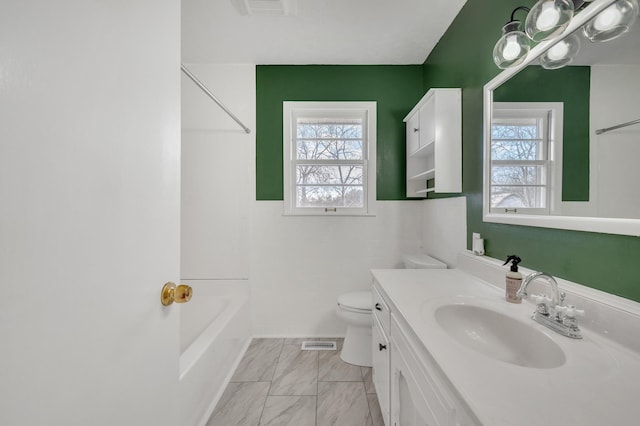 1077 Weeks Rd, Murfreesboro, TN 37127 - bathroom with vanity, marble look tiles, a wainscoted wall, tub / shower combination, and tile walls