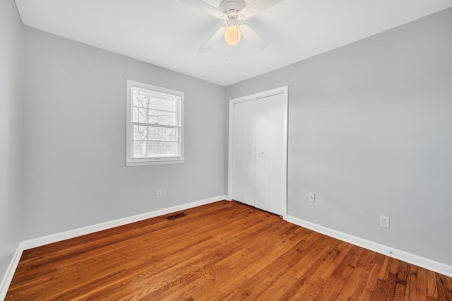 1077 Weeks Rd, Murfreesboro, TN 37127 - unfurnished bedroom with a closet, wood finished floors, and a ceiling fan