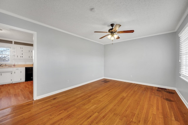 1077 Weeks Rd, Murfreesboro, TN 37127 - spare room featuring light wood finished floors, a ceiling fan, a textured ceiling, and ornamental molding