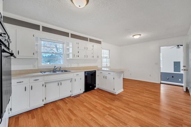 1077 Weeks Rd, Murfreesboro, TN 37127 - kitchen featuring a textured ceiling, black dishwasher, light wood-type flooring, a peninsula, and open shelves