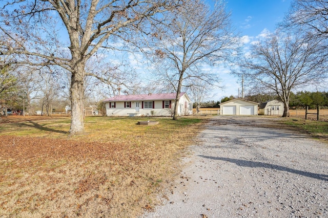 1077 Weeks Rd, Murfreesboro, TN 37127 - single story home featuring an outbuilding, a garage, and a front yard