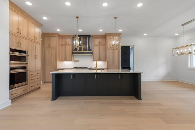 7312 Walker Rd, Fairview, TN 37062 - kitchen featuring a chandelier, light brown cabinetry, custom range hood, a spacious island, and light wood-style floors