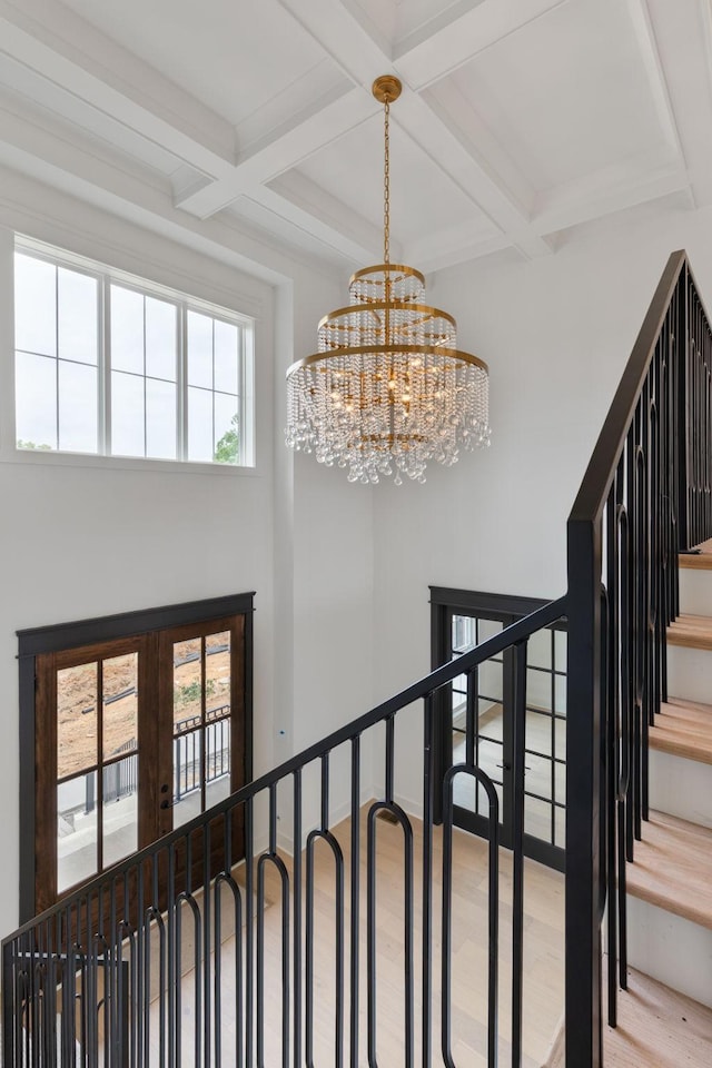 7312 Walker Rd, Fairview, TN 37062 - stairway with wood finished floors, coffered ceiling, a chandelier, beam ceiling, and french doors
