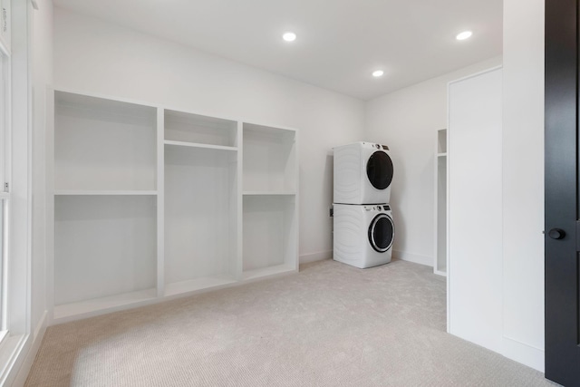 7312 Walker Rd, Fairview, TN 37062 - laundry area featuring stacked washer / dryer, carpet floors, and recessed lighting