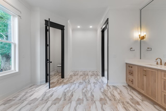 7312 Walker Rd, Fairview, TN 37062 - bathroom featuring vanity, healthy amount of natural light, marble finish flooring, ornamental molding, and recessed lighting