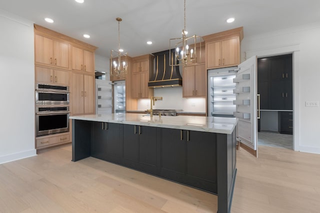 7312 Walker Rd, Fairview, TN 37062 - kitchen featuring light brown cabinets, a chandelier, light wood finished floors, double oven, and recessed lighting