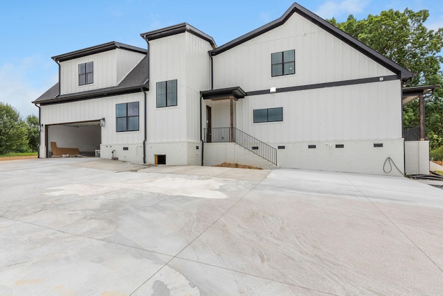 7312 Walker Rd, Fairview, TN 37062 - back of property with crawl space, concrete driveway, and a garage