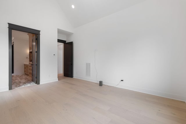 7312 Walker Rd, Fairview, TN 37062 - unfurnished bedroom with light wood-type flooring, high vaulted ceiling, and recessed lighting