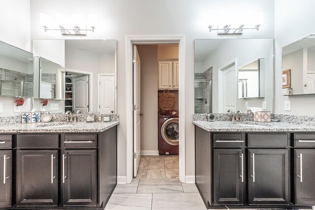 2044 Albatross Way, Gallatin, TN 37066 - full bath with washer / clothes dryer, a stall shower, two vanities, and marble finish flooring