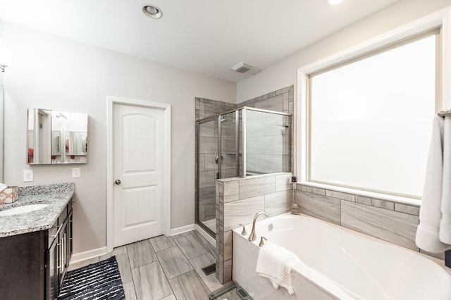 2044 Albatross Way, Gallatin, TN 37066 - full bathroom with a garden tub, vanity, a shower stall, and recessed lighting