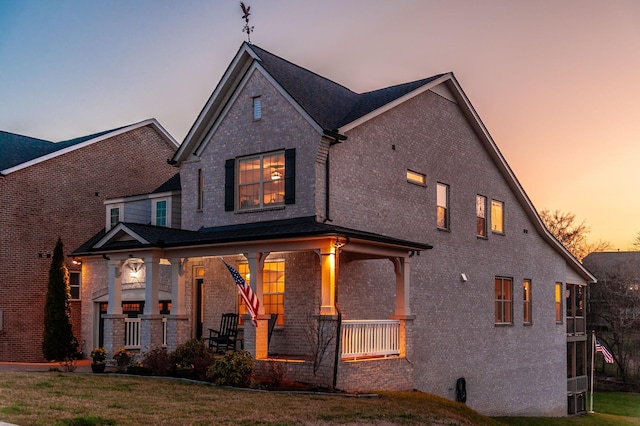 2044 Albatross Way, Gallatin, TN 37066 - back of property featuring brick siding, a yard, and covered porch