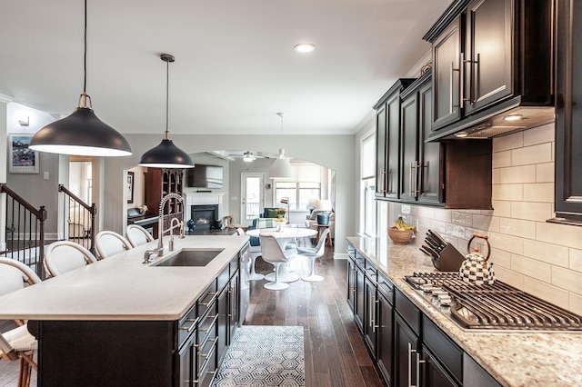 2044 Albatross Way, Gallatin, TN 37066 - kitchen with a kitchen breakfast bar, dark wood-type flooring, open floor plan, stainless steel gas cooktop, and a ceiling fan