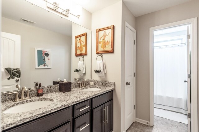 2044 Albatross Way, Gallatin, TN 37066 - bathroom featuring double vanity and baseboards