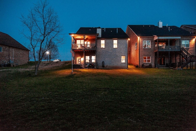 2044 Albatross Way, Gallatin, TN 37066 - back of property featuring a balcony, stairs, and a lawn