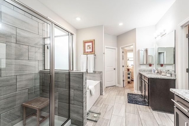 2044 Albatross Way, Gallatin, TN 37066 - ensuite bathroom with vanity, a bath, a shower stall, and recessed lighting