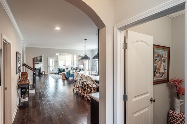 2044 Albatross Way, Gallatin, TN 37066 - hallway featuring arched walkways, dark wood-type flooring, crown molding, and recessed lighting