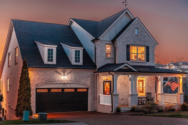 2044 Albatross Way, Gallatin, TN 37066 - craftsman house with covered porch, brick siding, asphalt driveway, and stone siding