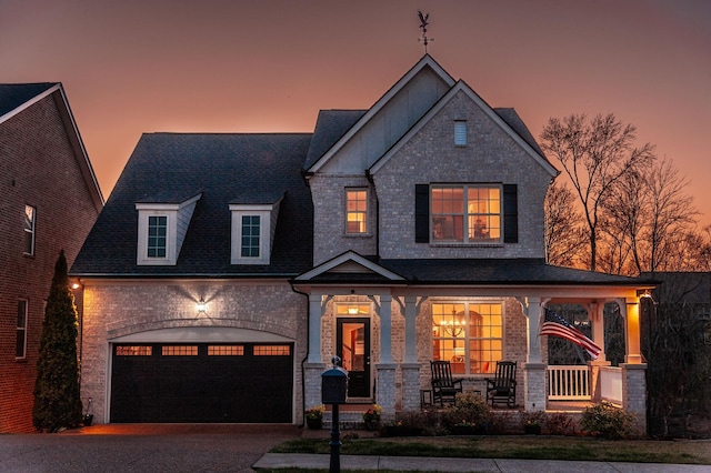 2044 Albatross Way, Gallatin, TN 37066 - view of front facade featuring covered porch, driveway, a garage, and stone siding