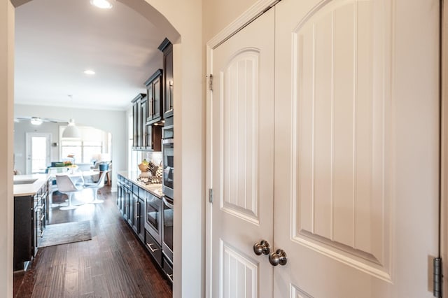 2044 Albatross Way, Gallatin, TN 37066 - bar area featuring dark wood finished floors, arched walkways, hanging light fixtures, a ceiling fan, and recessed lighting