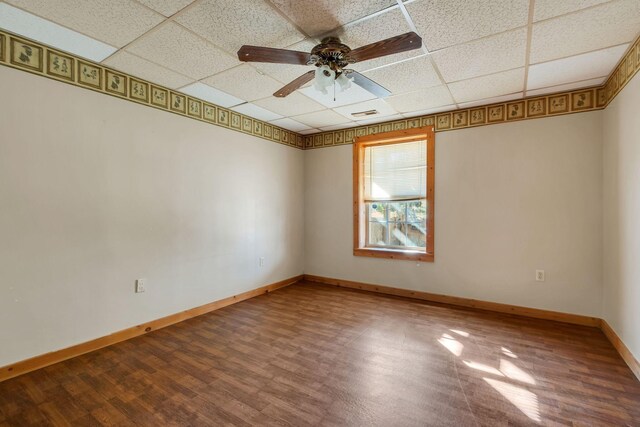 1010 Scott Rd, Bethpage, TN 37022 - spare room featuring wood finished floors, a drop ceiling, and a ceiling fan