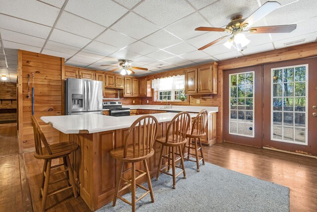 1010 Scott Rd, Bethpage, TN 37022 - kitchen featuring appliances with stainless steel finishes, a ceiling fan, healthy amount of natural light, a drop ceiling, and light countertops