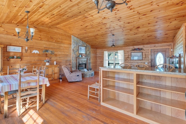 1010 Scott Rd, Bethpage, TN 37022 - dining area with wooden ceiling, wooden walls, lofted ceiling, wood finished floors, and a chandelier
