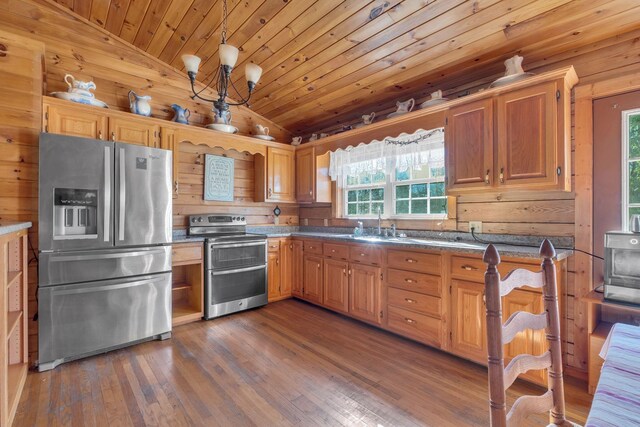 1010 Scott Rd, Bethpage, TN 37022 - kitchen featuring stainless steel appliances, lofted ceiling, healthy amount of natural light, wood walls, and wooden ceiling