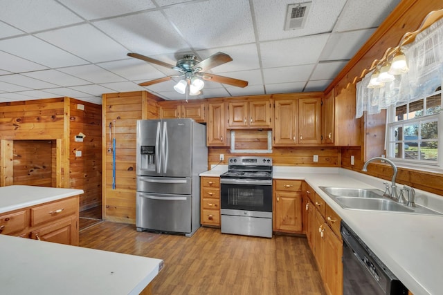 1010 Scott Rd, Bethpage, TN 37022 - kitchen featuring stainless steel appliances, light wood-type flooring, light countertops, a paneled ceiling, and a ceiling fan
