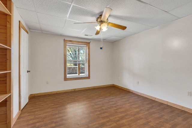 1010 Scott Rd, Bethpage, TN 37022 - empty room with a paneled ceiling, wood finished floors, and ceiling fan