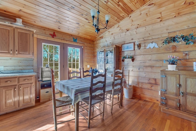 1010 Scott Rd, Bethpage, TN 37022 - dining area featuring french doors, lofted ceiling, wooden ceiling, light wood-type flooring, and wooden walls