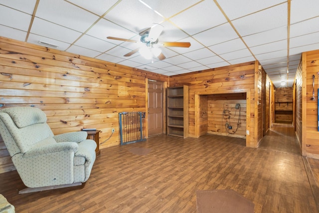 1010 Scott Rd, Bethpage, TN 37022 - unfurnished room featuring wood walls, wood finished floors, a ceiling fan, and a drop ceiling