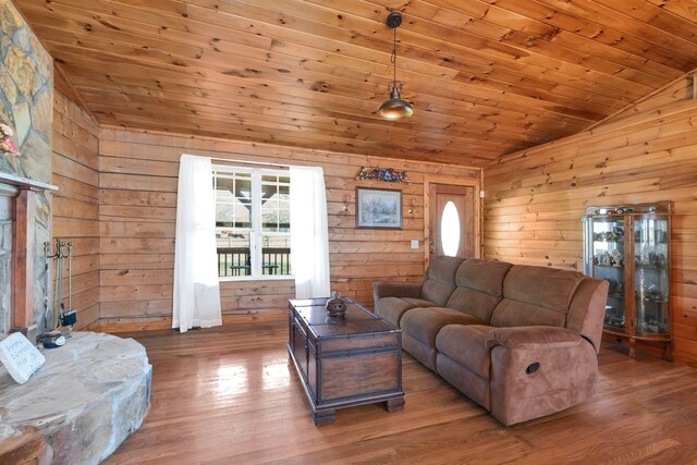 1010 Scott Rd, Bethpage, TN 37022 - living area featuring lofted ceiling, wood walls, wood finished floors, and wooden ceiling
