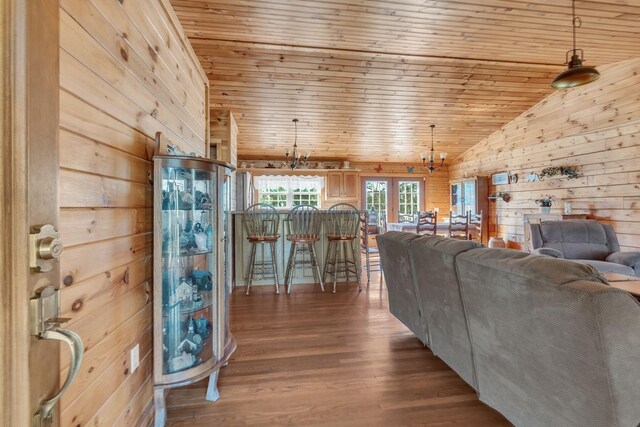 1010 Scott Rd, Bethpage, TN 37022 - living room featuring wooden walls, wooden ceiling, lofted ceiling, dark wood finished floors, and a chandelier