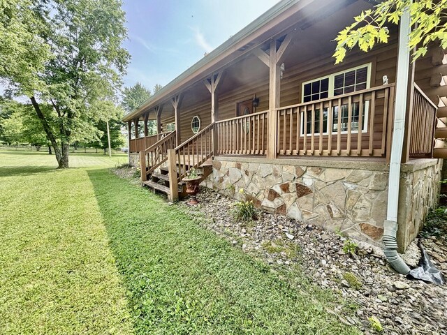1010 Scott Rd, Bethpage, TN 37022 - view of side of home featuring a yard and covered porch
