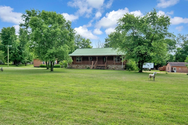1010 Scott Rd, Bethpage, TN 37022 - view of front facade featuring a porch, a front lawn, and a metal roof