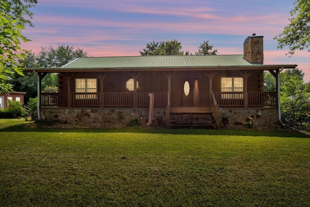 1010 Scott Rd, Bethpage, TN 37022 - log home featuring a chimney, log siding, a front yard, and covered porch