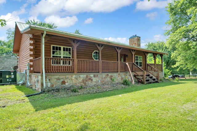 1010 Scott Rd, Bethpage, TN 37022 - log home with a porch, a chimney, a front yard, a metal roof, and log siding
