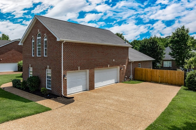 3134 Friars Bridge Pass, Franklin, TN 37064 - view of side of home with driveway, brick siding, roof with shingles, and a garage