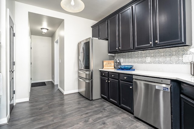 3134 Friars Bridge Pass, Franklin, TN 37064 - kitchen featuring appliances with stainless steel finishes, dark cabinetry, backsplash, and dark wood-type flooring