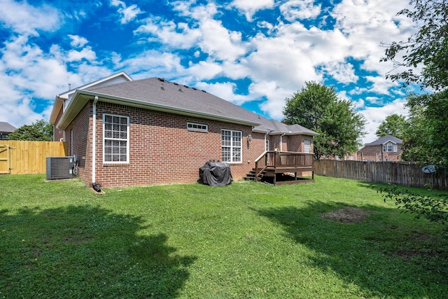 3134 Friars Bridge Pass, Franklin, TN 37064 - rear view of house with brick siding, a fenced backyard, and a deck