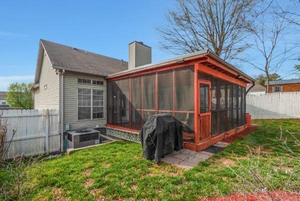 1707 University Dr, Columbia, TN 38401 - back of property featuring a sunroom and a chimney