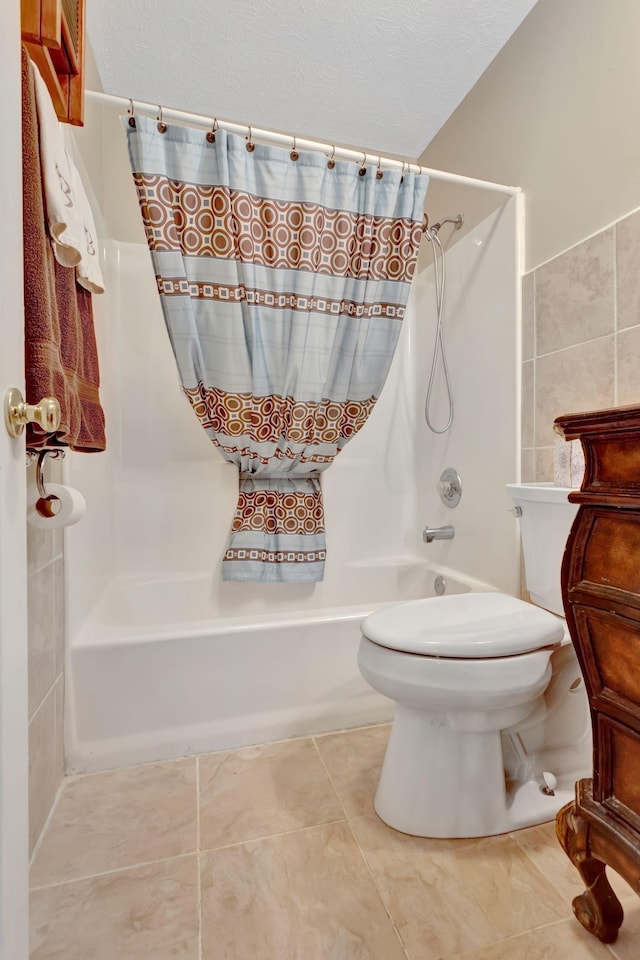 1707 University Dr, Columbia, TN 38401 - bathroom featuring shower / tub combo, tile patterned flooring, tile walls, and a textured ceiling