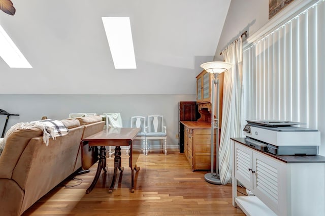 1707 University Dr, Columbia, TN 38401 - dining area with a skylight, lofted ceiling, and light wood-style flooring